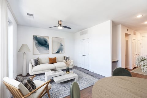 a living room with white walls and a white couch